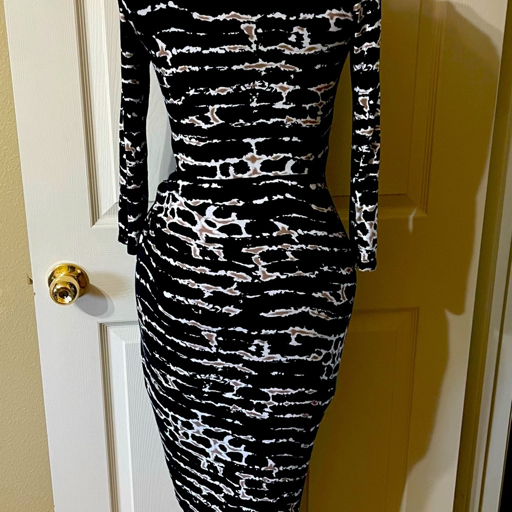 Cute, & fun asymmetrical dress. Purchased from Venus, size small & multi color